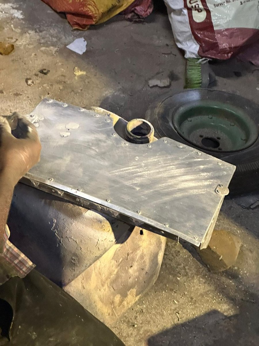 Unpainted cowl-flap prototype assembly showing the formed metal panels